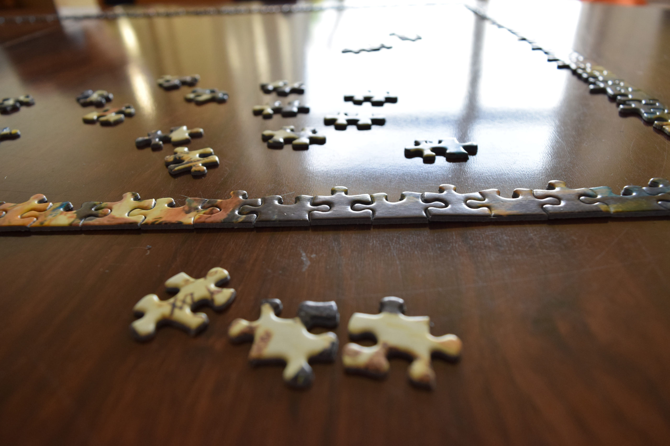 Image of puzzle piece edges put together on a table to start a jigsaw puzzle